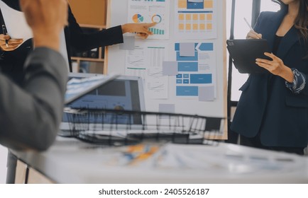 Close up ux developer and ui designer use augmented reality brainstorming about mobile app interface wireframe design on desk at modern office.Creative digital development agency