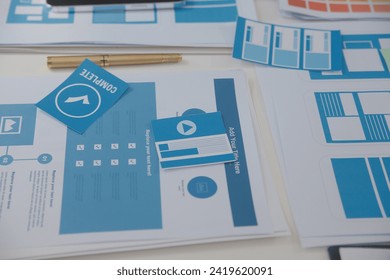 Close up ux developer and ui designer use augmented reality brainstorming about mobile app interface wireframe design on desk at modern office.Creative digital development agency