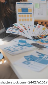 Close up ux developer and ui designer use augmented reality brainstorming about mobile app interface wireframe design on desk at modern office.Creative digital development agency
