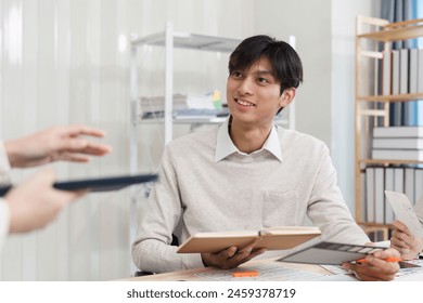 Close up ux developer and ui designer brainstorming interface wireframe design.Creative digital development agency