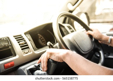 Close Up Of Van Driver Driving Passenger Bus