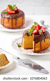 Close up of a vanilla and chocolate cake with strawberries