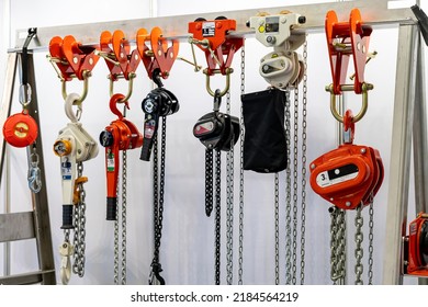 Close up various kind of industrial manual chain hoist such as hand pull and lever type for lifting object and reduce work load storage on hanger line