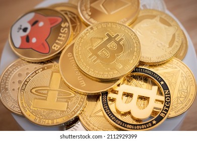 Close up of various kinds of cryptocurrency token coins. Cryptocurrency is a digital or virtual currency that is secured by cryptography.