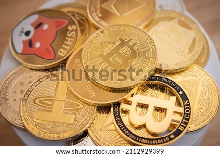 Close up of various kinds of cryptocurrency token coins. Cryptocurrency is a digital or virtual currency that is secured by cryptography.