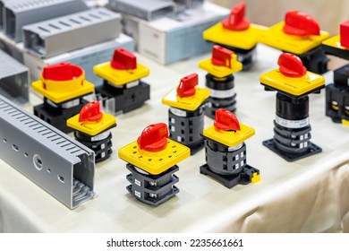 Close up various type of selector switch or rotary cam selector switch for electric power industrial and wire way slot trunking on table - Shutterstock ID 2235661661