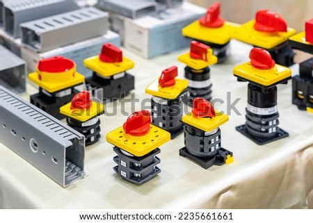 Close up various type of selector switch or rotary cam selector switch for electric power industrial and wire way slot trunking on table