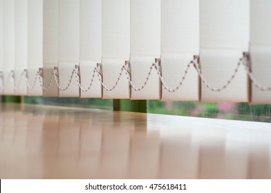 Close up vertical blind for the office room decoration. Design of curtain bright for interior office. Modern style of sun blinds for office and abstract background.