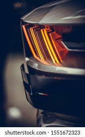 Close up vertical image of the LED tail lights of a new sport super car.