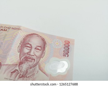 Close up a Vietnamese currency 50.000 dong banknote over white background - Shutterstock ID 1265127688