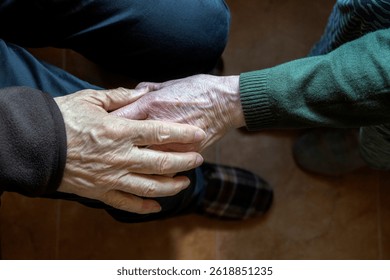 Close view of aged hands gently holding, symbolizing compassion, care, and emotional support. Perfect for illustrating themes of empathy, senior care, and meaningful human connections.