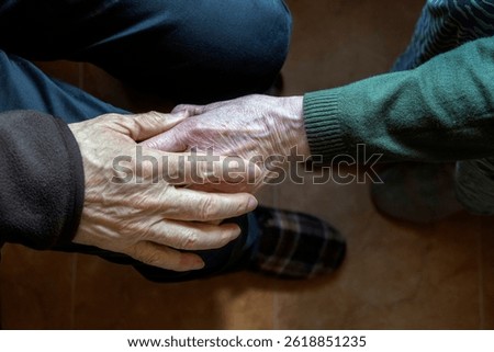 Close view of aged hands gently holding, symbolizing compassion, care, and emotional support. Perfect for illustrating themes of empathy, senior care, and meaningful human connections.