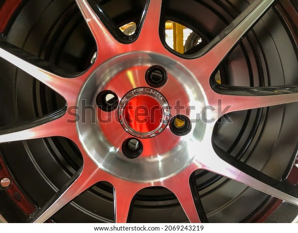 Close up view of alloy car rim. Selective focus\
with noise effect