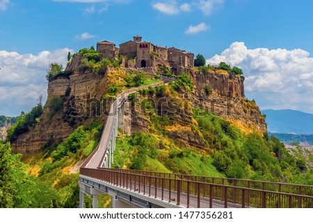 A close up view approaching the hill top settlement of Civita di Bagnoregio in Lazio, Italy in summer