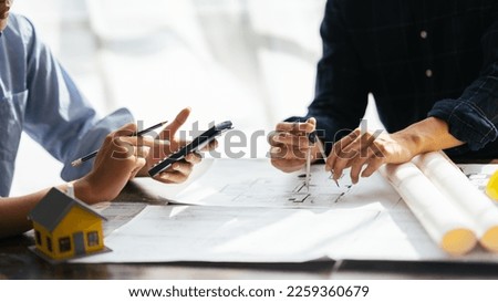 close up view of architect and engineer hands measuring living house blueprint. architect and engineer concept.