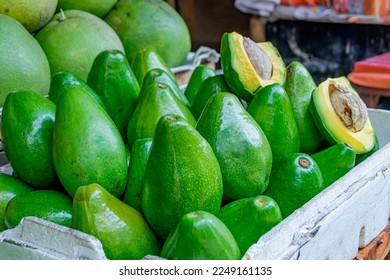 close up view of avocados being traded in traditional markets - Shutterstock ID 2249161135