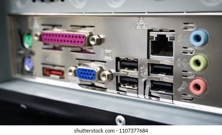 close up view of back PC computer connection panel detailed with many ports type and others sockets.