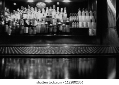 A Close Up View Of A Bar Mat With A Blurry Background