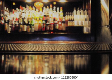 A Close Up View Of A Bar Mat With A Blurry Background