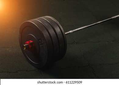 Close up view of barbell on floor in gym