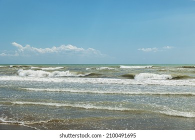 
Close Up View From A Beach On A Sea Landscape At Daytime During Summer Season Under A Clear Sky, Beautiful Rough Water And View On The Horizon, Travel And Summer Holidays Locations, Italy 