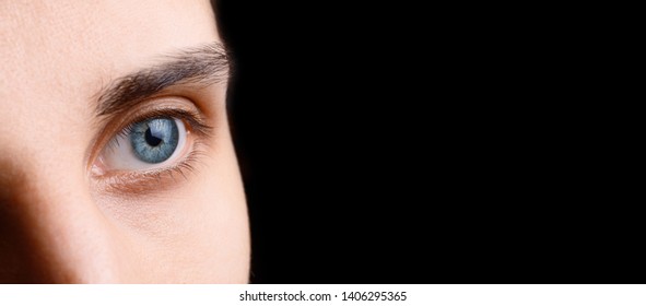 Close Up View Of Beautiful Blue Male Eye On Dark Background. Good Vision, Contact Lenses. Eye Health And Care. Macro Eyes.