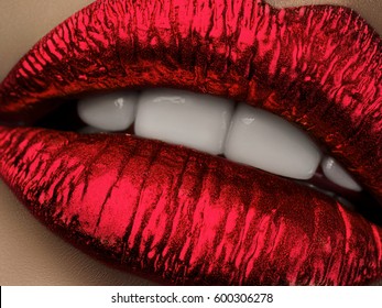 Close up view of beautiful woman lips with red metallic lipstick. Open mouth with white teeth. Cosmetology, drugstore or fashion makeup concept. Beauty studio shot. Passionate kiss