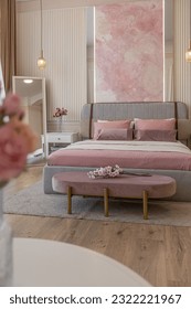 a close view of the bedroom in a modern cozy soft interior in warm delicate pastel pink and beige colors - Shutterstock ID 2322221967