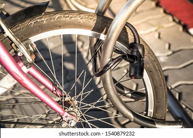 Close up view of bicycle  locked to bike rack. - Shutterstock ID 1540879232
