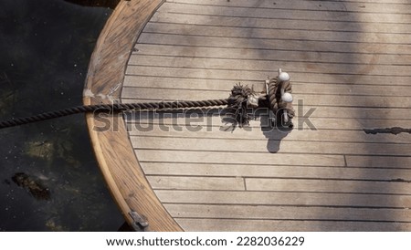 Close up view bitt - paired vertical metal posts mounted aboard ship nose. posts are used to secure mooring lines, ropes, hawsers, or cables. Bitts aboard wooden sailing ships knecht.