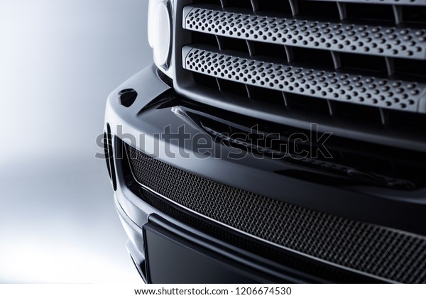 close up view
of black automobile as
background