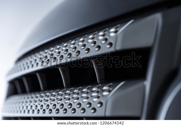 close up view\
of black automobile as\
background