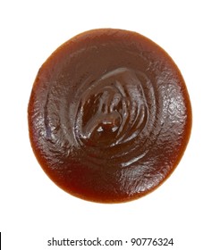 Close View Of A Blob Of Barbecue Sauce On A White Background.