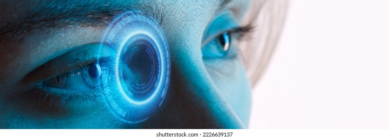 Close up view of blue eye with futuristic holographic interface to display data. Portrait of beautiful young woman, half of face. Augmented reality, future technology, internet concept. - Shutterstock ID 2226639137