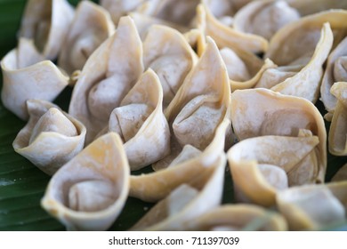 Close up view of boiled meat dumpling on wooden background. - Powered by Shutterstock