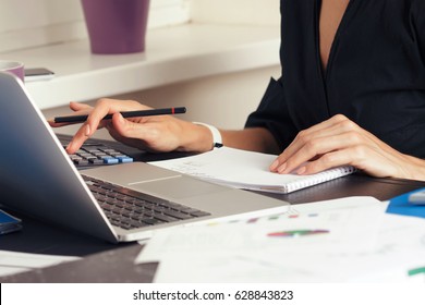 Close up view of bookkeeper or financial inspector hands making report, calculating or checking balance. Home finances, investment, economy, saving money or insurance concept - Shutterstock ID 628843823