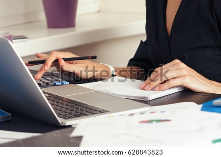 Close up view of bookkeeper or financial inspector hands making report, calculating or checking balance. Home finances, investment, economy, saving money or insurance concept