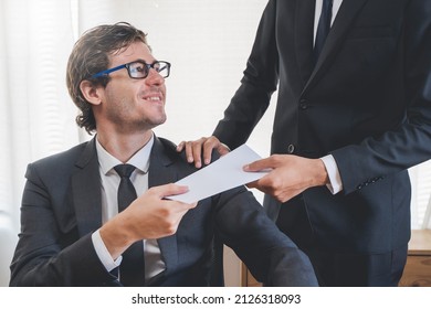 Close up view of boss giving commission bonus to office worker. - Shutterstock ID 2126318093