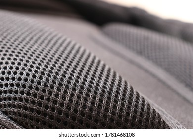 Close Up View Of Breathable Mesh Fabric Of The Black Backpack