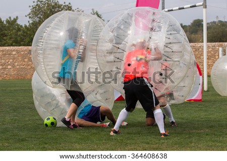 Close up view of bubble football balls game.