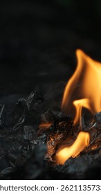 A close up view of burning ash creates a mesmerizing scene of destruction and renewal, perfect for use as a dramatic visual element.