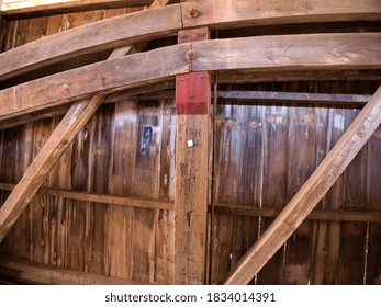 Close Up View Of The Burr Arch Truss Of A Restored Old 1844 Covered Bridge On A Sunny Day 