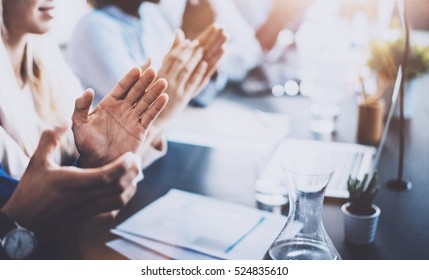 Close up view of business seminar listeners clapping hands. Professional education, work meeting, presentation or coaching concept.Horizontal,blurred background