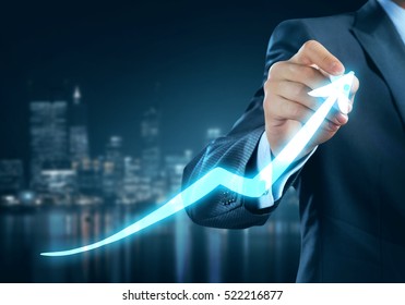 Close view of businessman drawing on screen growing graph - Powered by Shutterstock