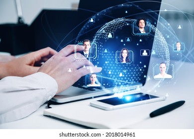 Close up view businessman hands working on laptop to find new candidate to hire they for international projects at business consultancy company. Concept of HR and employees