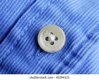 Close Up View Of A Button From A Shirt