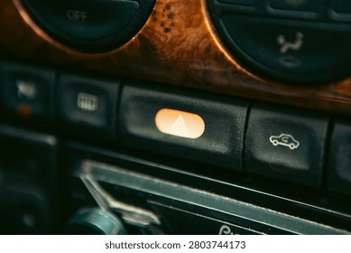 Close up view of a car dashboard with control buttons and buttons.
