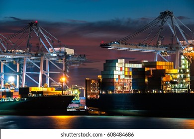 Close Up View Cargo Freight Ship And Cargo Container Working With Crane At Port Area,Logistic Import Export At Night