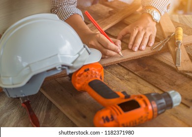 Close Up view of Carpenter working on woodworking machines in renovation work at home