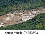 CLOSE VIEW OF CASCADING RIVER